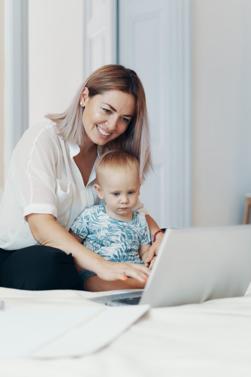 woman-and-toddler-laptop-800px Smiling mother and toddler using a laptop together.